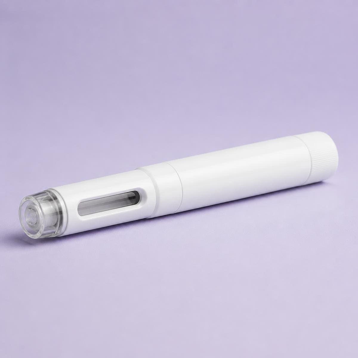 Unbranded treatment pen resting on a soft lilac surface